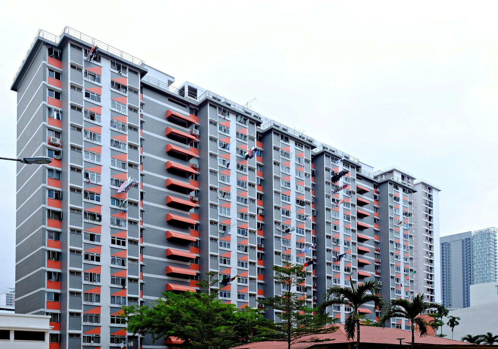 white concrete building near green trees during daytime
